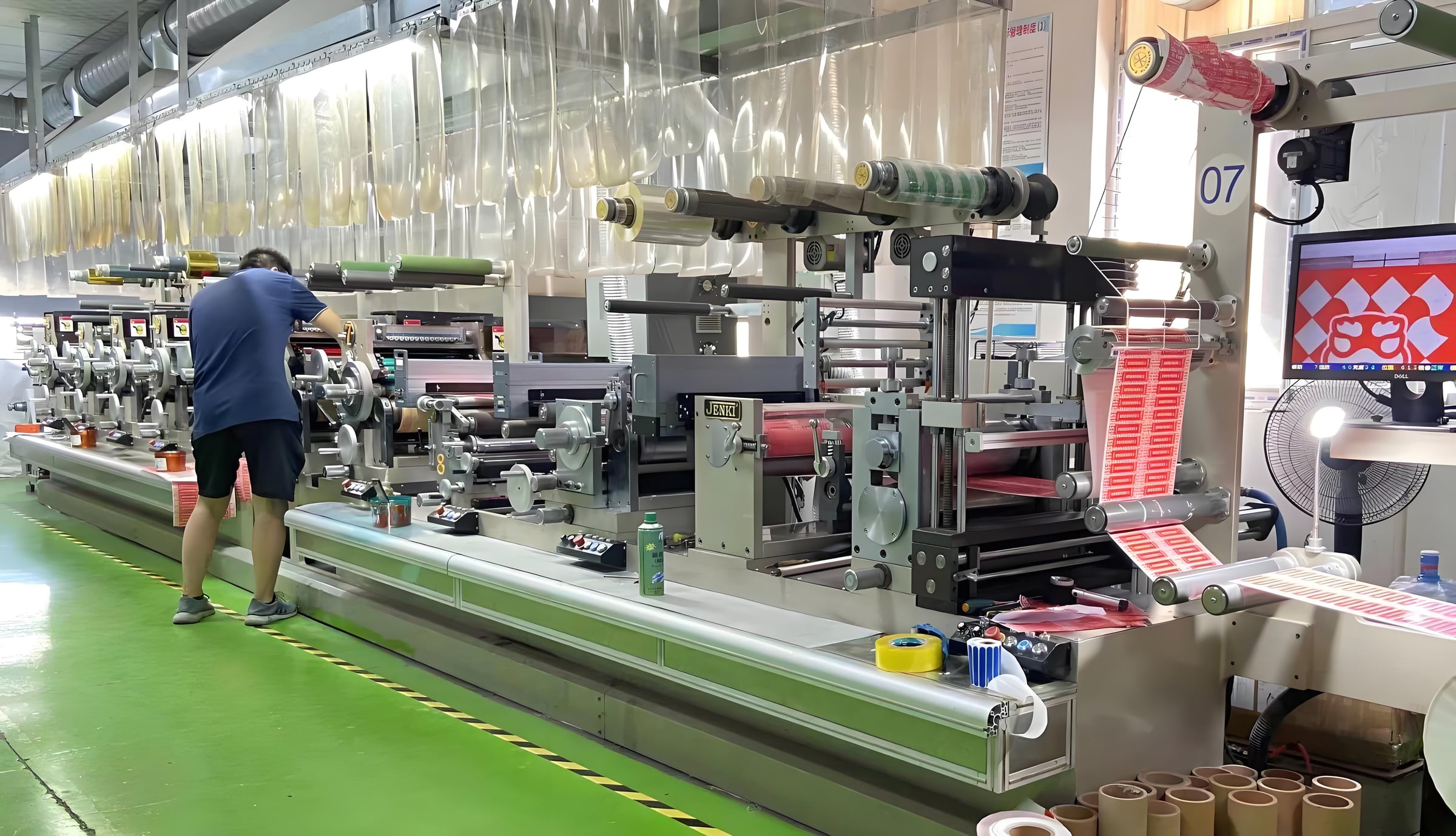Roll-fed lamination and converting equipment in a factory